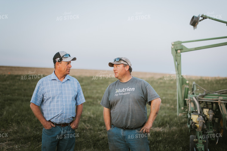 Farmers Talk Beside Planter 7738