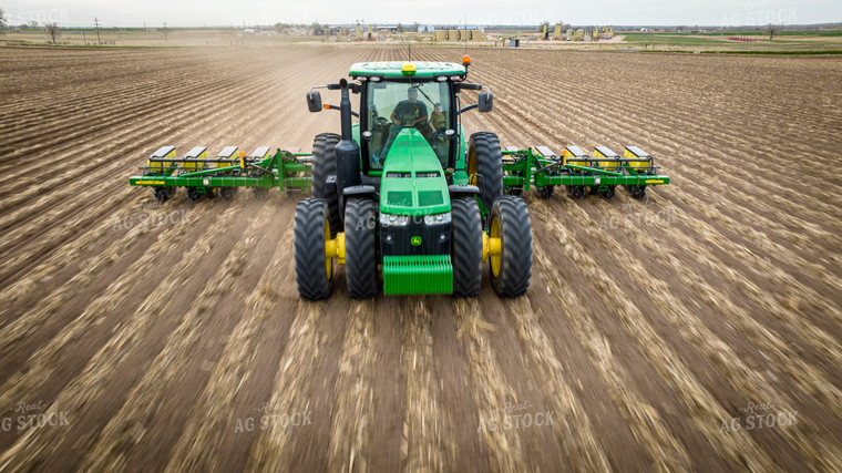 Farm Kid Sits in Buddy Seat While Planting Field 56636