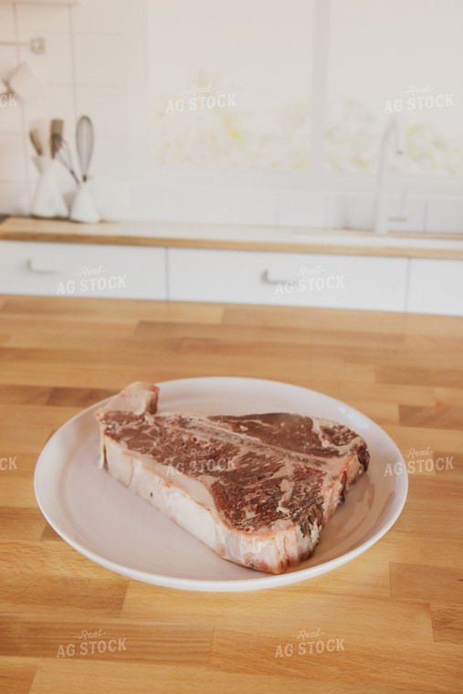 Raw Steak on Plate on Kitchen Countertop 67327