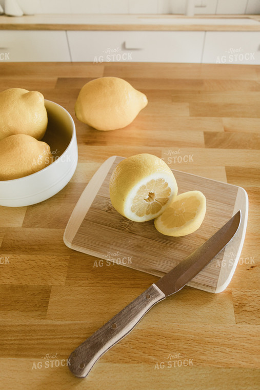 Sliced Lemon on Cutting Board on Kitchen Countertop 67328