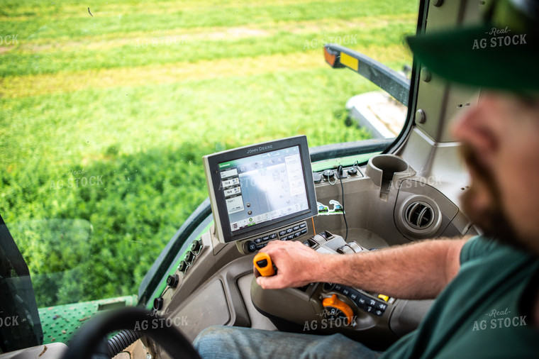 Farmer Driving Tractor with Equipment GPS Monitor Visible 56672