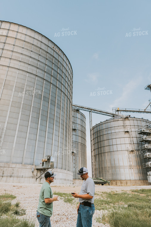 Farmers Talking by Grain Bins 7795