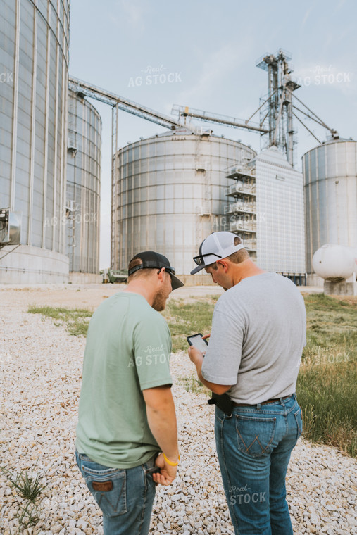 Farmers Talking by Grain Bins 7797