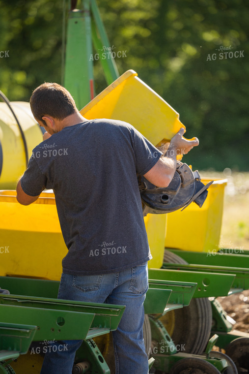 Farmer Dumping Seed Box 104017