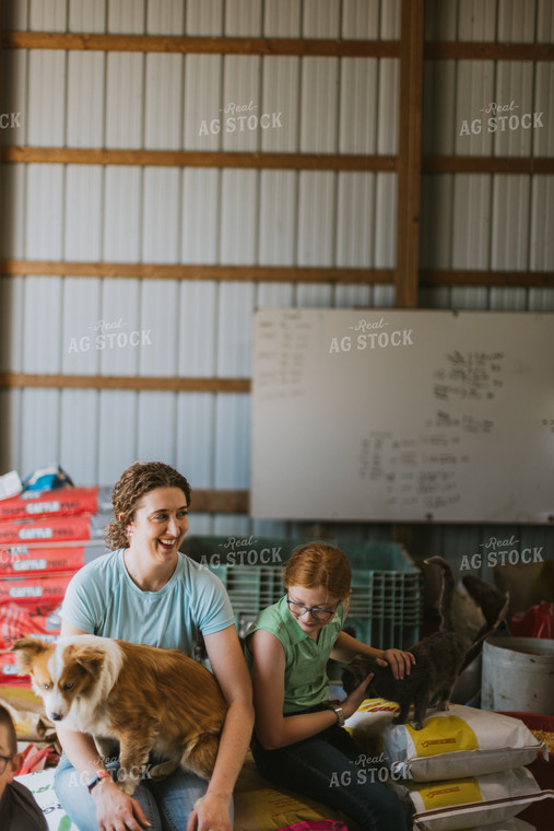 Female Farmer and Kid with Farm Dogs 7884