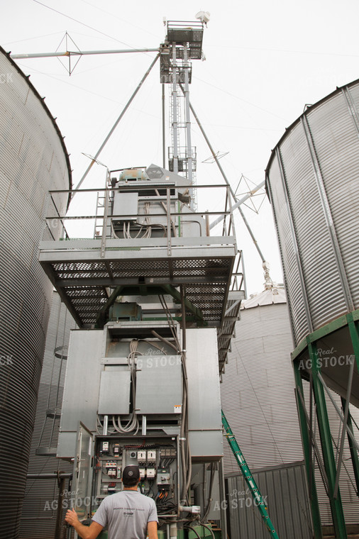 Farmer Fixing Grain Dryer 26019