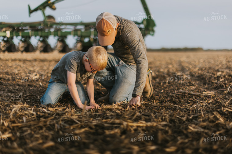 Farmer Checking Seed Depth with Son 8222