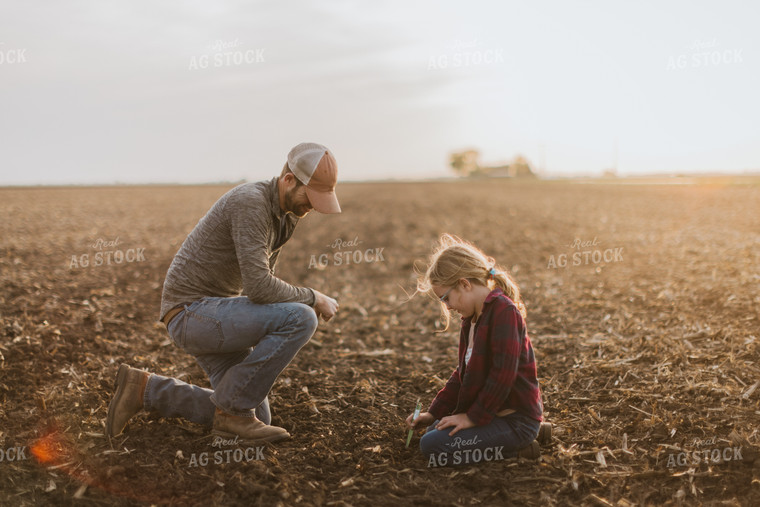 Farmer Checking Seed Depth with Daughter 8228