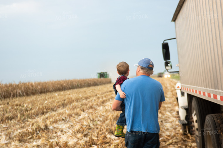 Farmer and Grandson in Field with Semi Truck 129073