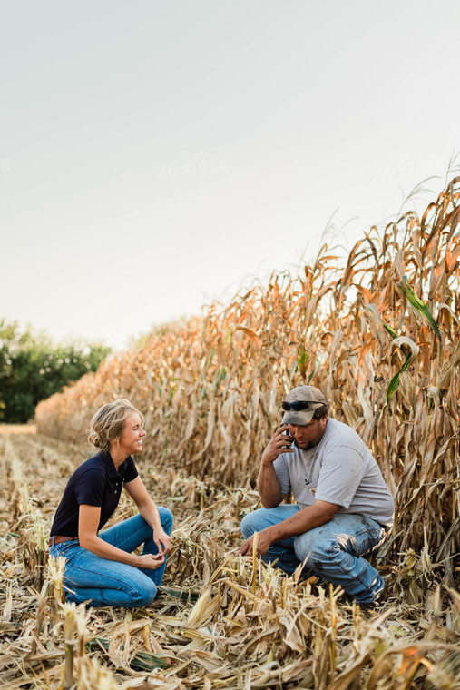 Farmer and Agronomist Using Phone in Field 8290