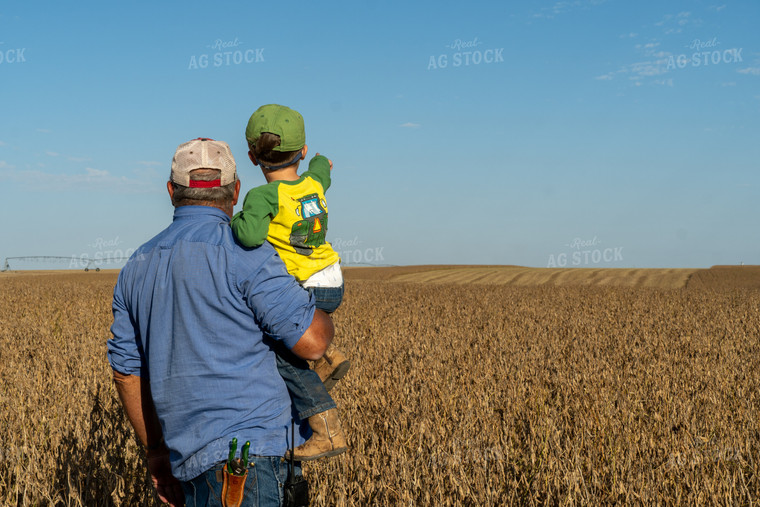 Farmer and Farm Kid Checking Beans 65091