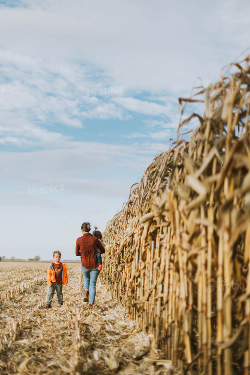 Female Farmer and Kids Checking Corn 8514
