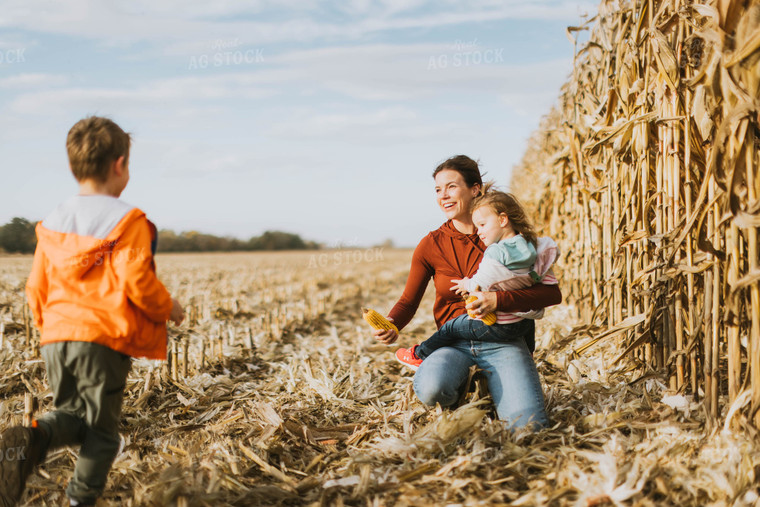 Female Farmer and Kids Playing in Cornfield 8520