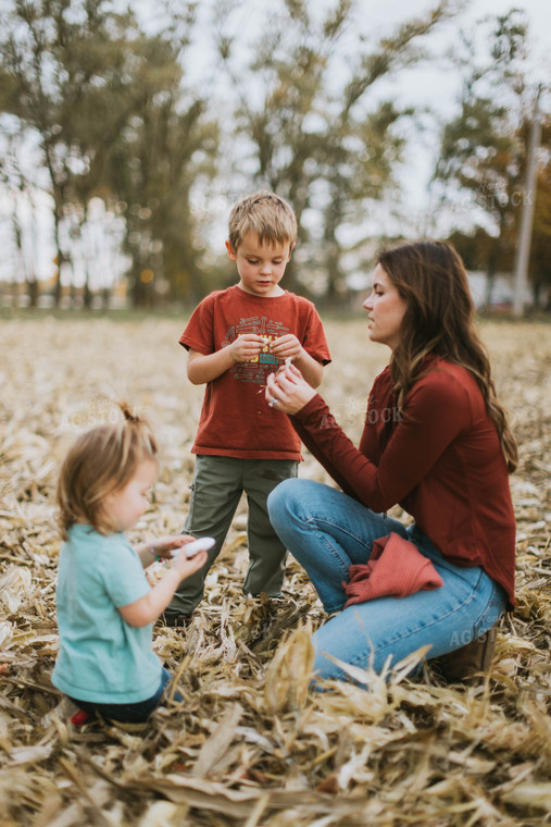 Female Farmer and Kids Playing in Cornfield 8614