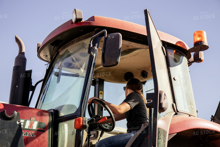 Female Farmer Driving Tractor 67539