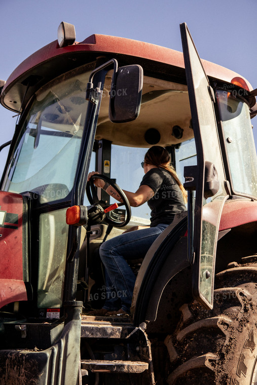 Female Farmer Driving Tractor 67540