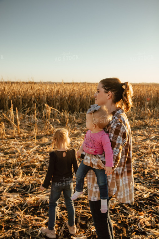 Female Farmer and Kids Checking Corn 67548
