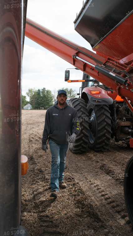 Farmer Walking by Tractor 26268