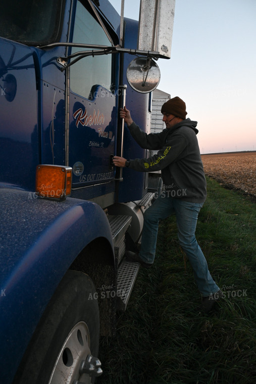 Farmer Climbing into Semi Truck 26290