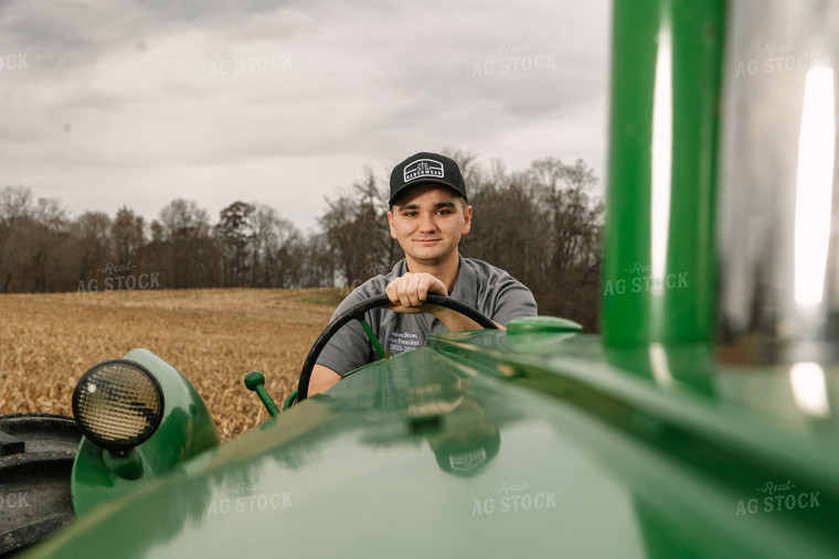 Farmer Operating Tractor 52647