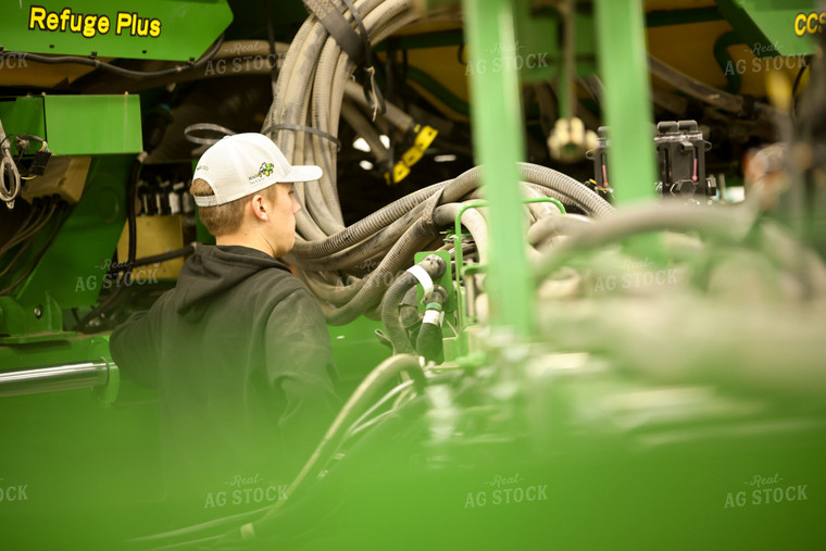 Farmer Fixing Planter 161119