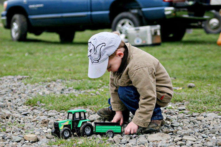Farm Kid Playing with Toy Tractor 181000