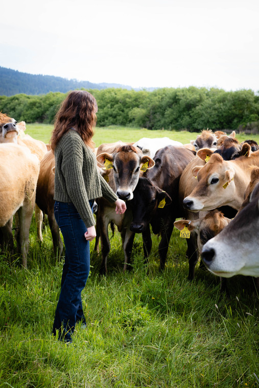 Female Farmer in Pasture with Jersey Cattle 181026