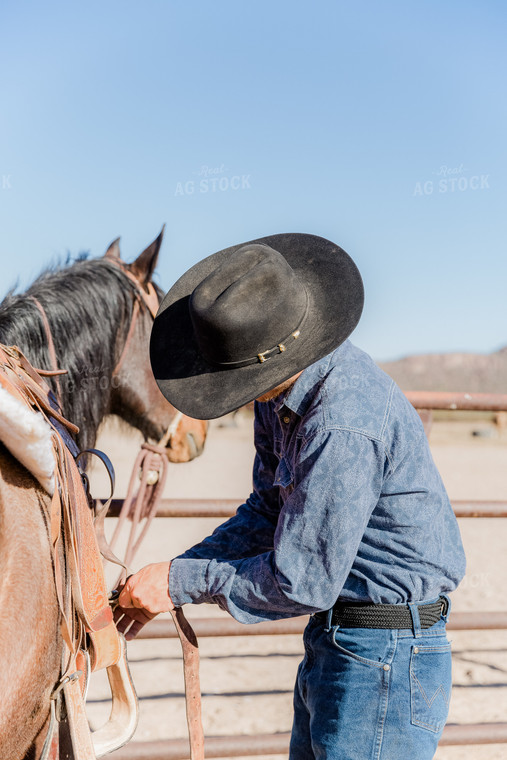 Rancher Saddling Horse 184023