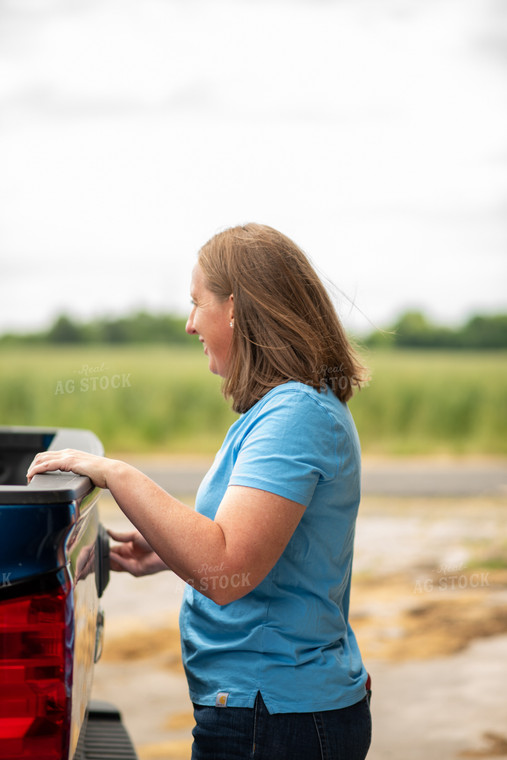 Female Farmer Closing Truck Bed 76528