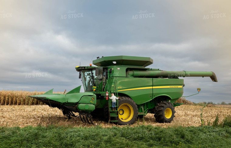 Farm Kid Climbing into Combine 185085