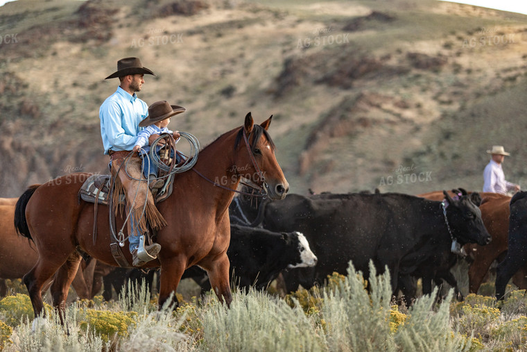 Rancher and Ranch Kid on Horseback 188046