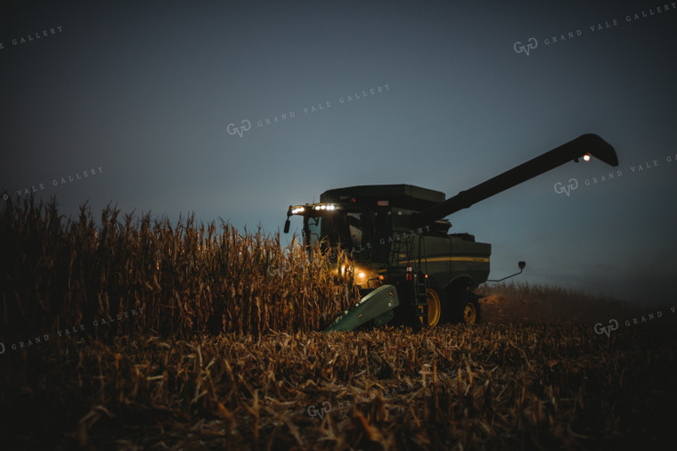 Combine Picking Corn with Lights On at Dusk 3405