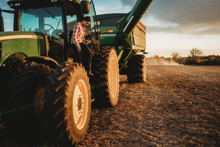 Female Farmer Climbing out of Tractor 3465