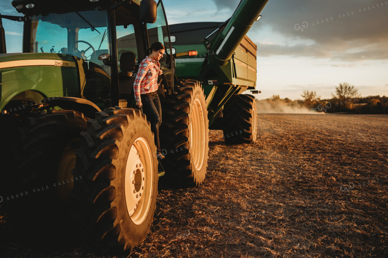 Female Farmer Climbing out of Tractor 3466