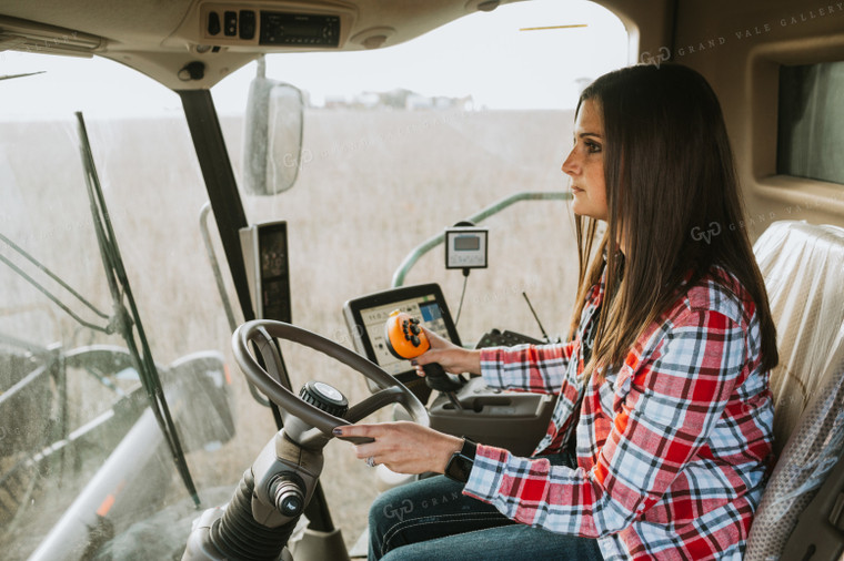 Female Farmer Driving Combine 3491