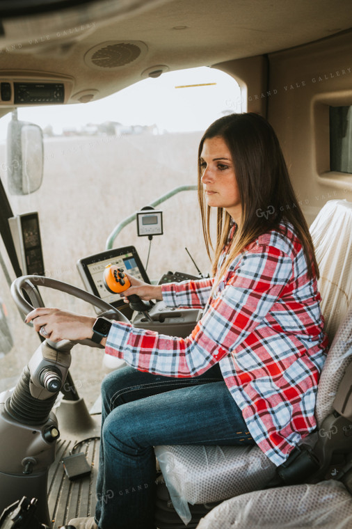 Female Farmer Driving Combine 3492