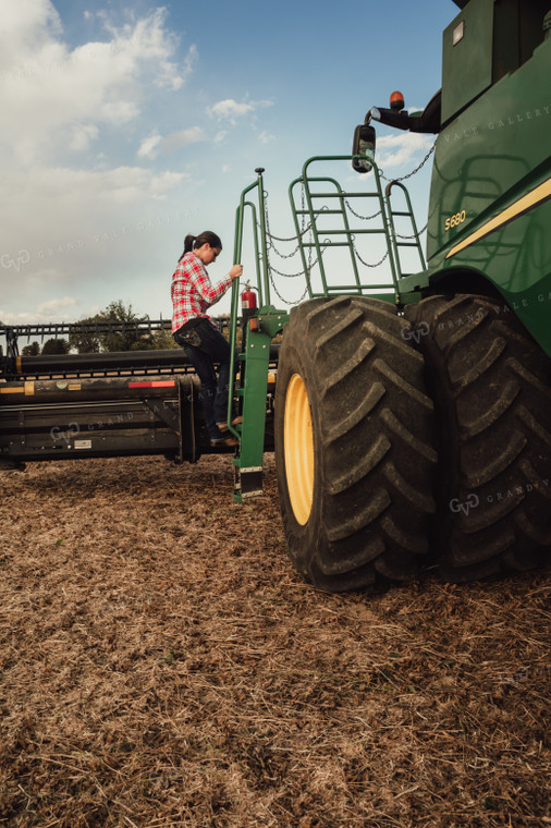 Female Farmer Getting In Out of Combine 3498