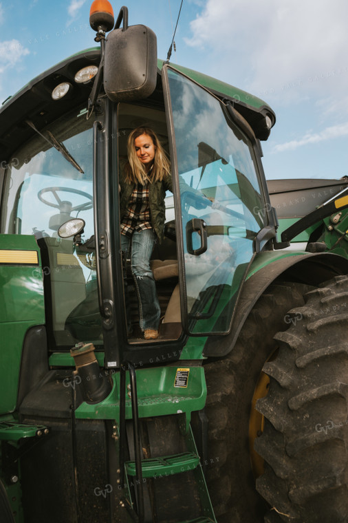 Female Farmer Getting out of Tractor 3512