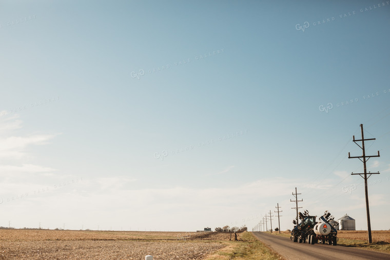 Tractor and Anhydrous Ammonia Tanks on Road 3565