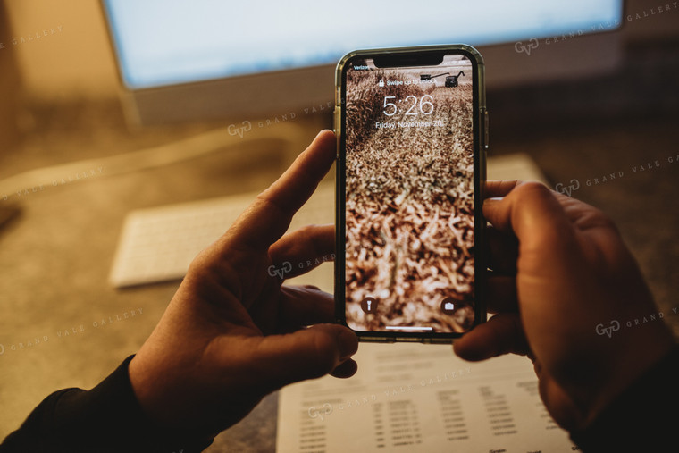 Farmer Using Smart Phone for Farm Accounting 3705