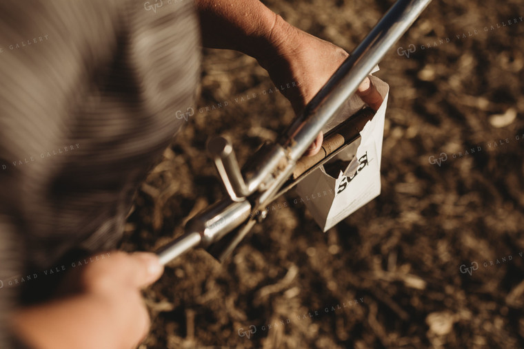 Farmer Putting Soil Core in Soil Sample Bag 3716