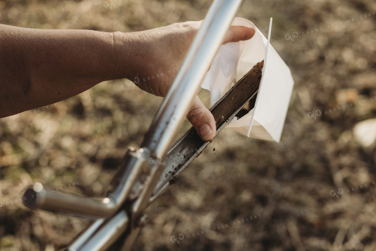 Farmer Putting Soil Core in Soil Sample Bag 3722