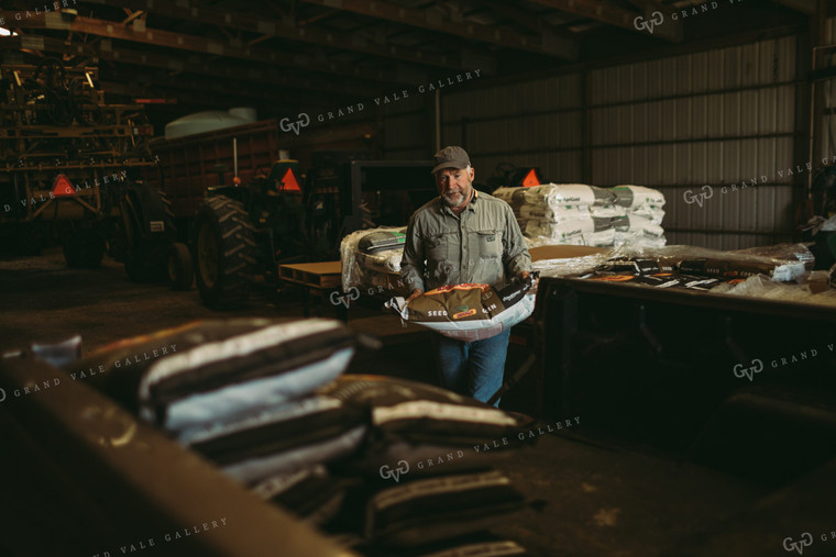 Farmer Loading Seed Bags 4079