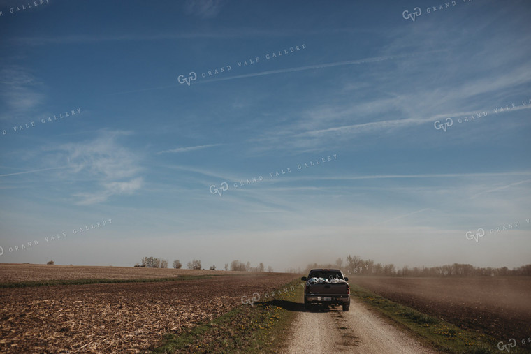 Seed Bags in Pickup Truck on Dirt Road 4084