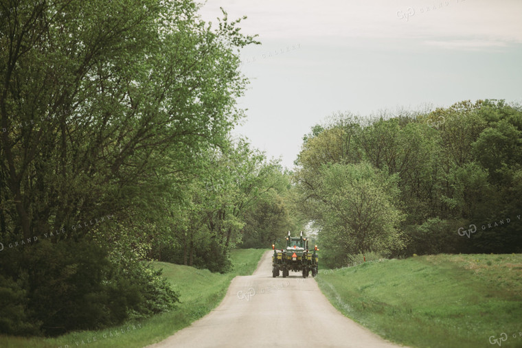 Tractor and Planter Driving Down Road 4014