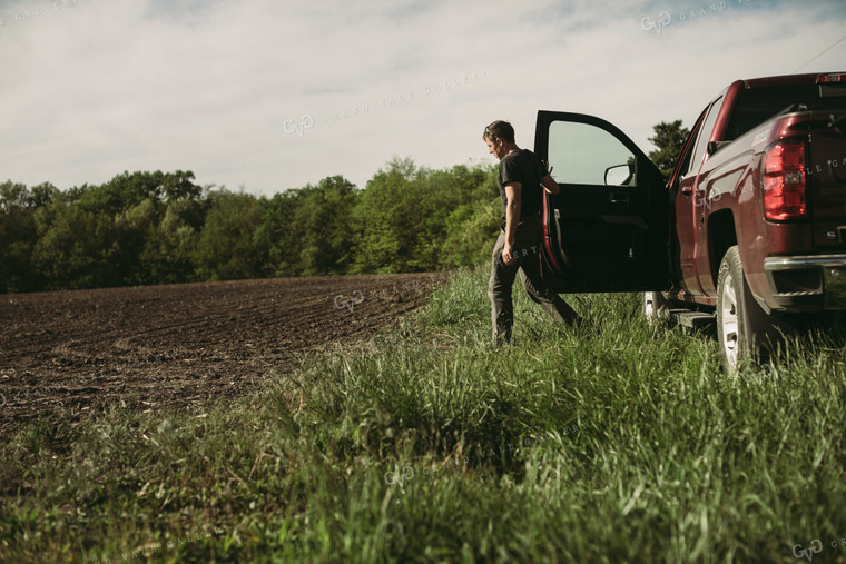 Farmer Getting Out of Pickup Truck 4157