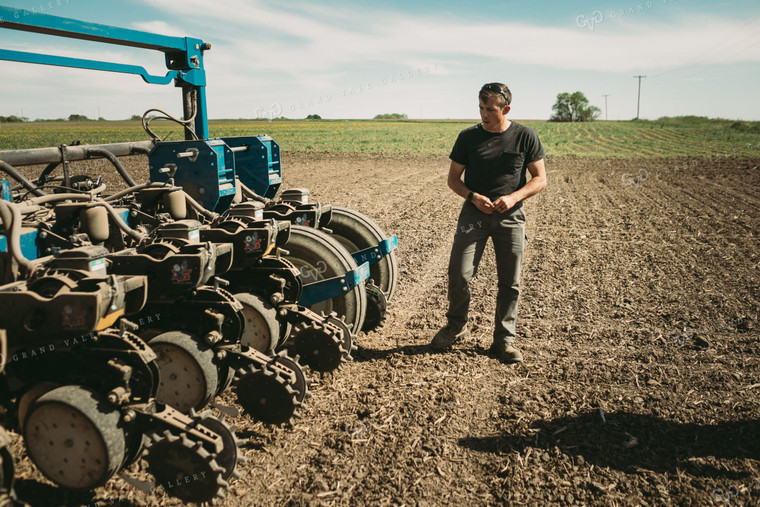 Farmer Adjusting Planter 4268