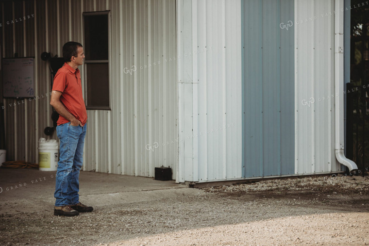 Farmer Standing Outside Shed 4479