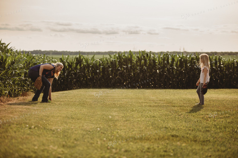 Farm Family Playing Catch Alongside Corn Field 4491