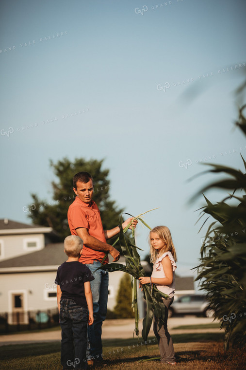 Farmer and Farm Kids Checking Corn Crop 4506